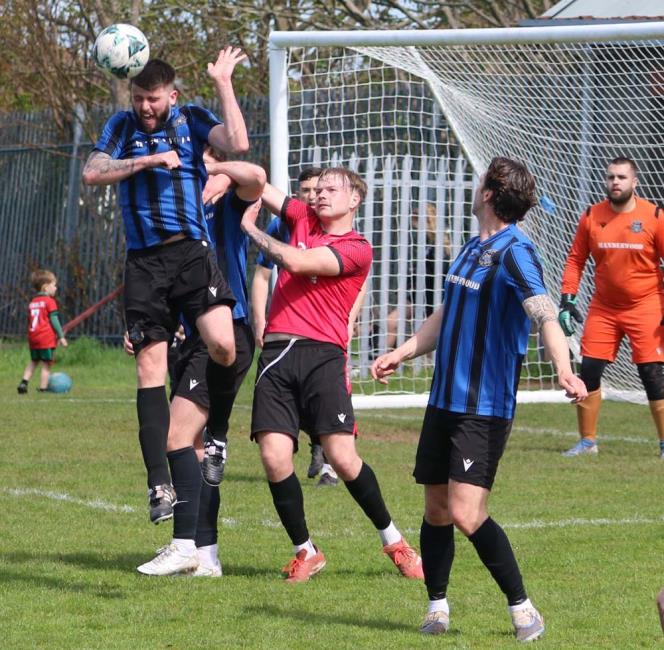 Shane Walsh clearly wins this aerial battle. Picture Tim Phillips